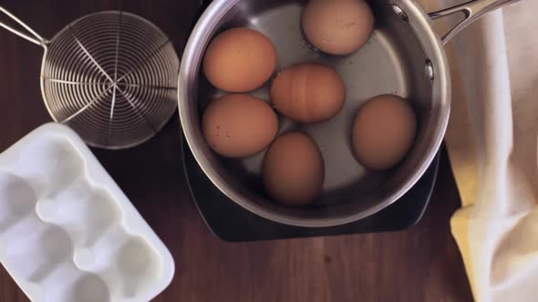 Boiling organic eggs for deviled eggs recipe.