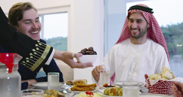 Family Having Dates During Ramadan Dinner or Iftar