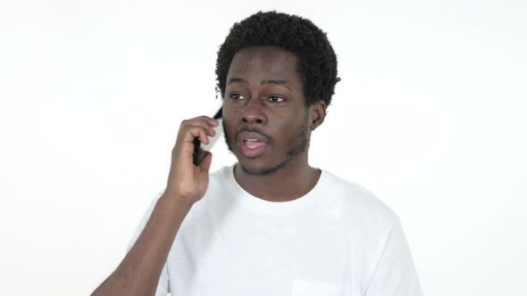 African Man Talking on Smartphone, White Background