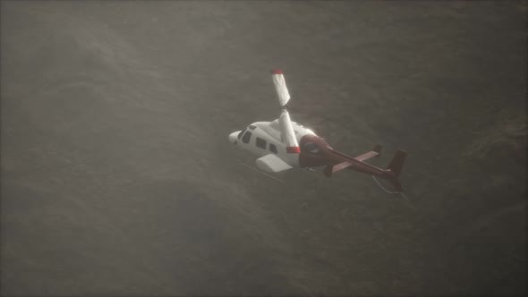 Extreme Slow Motion Flying Helicopter Near Mountains with Fog