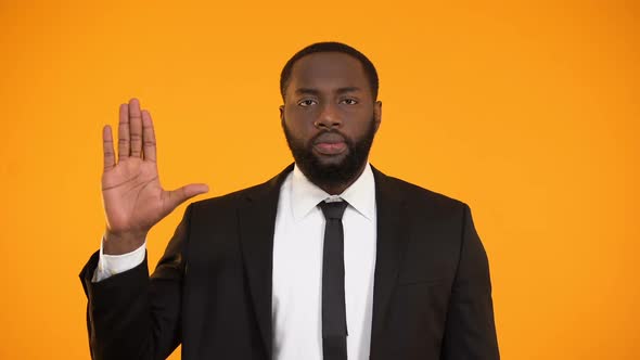 Self-Confident Afro-American Male in Suit Swearing an Oath, Election Campaign