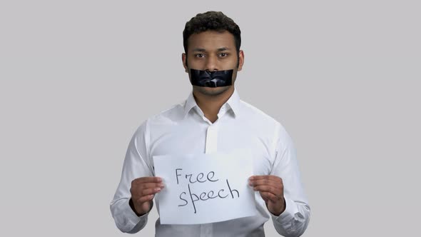 Portrait of Darkskinned Activist Showing Free Speech Banner