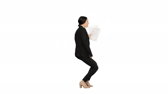 Excited Business Woman Dancing with a Bunch of Papers in Her Hand on White Background