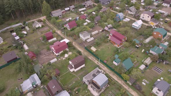 Aerial View of the Countryside with Small Garden Houses and Dirt Roads