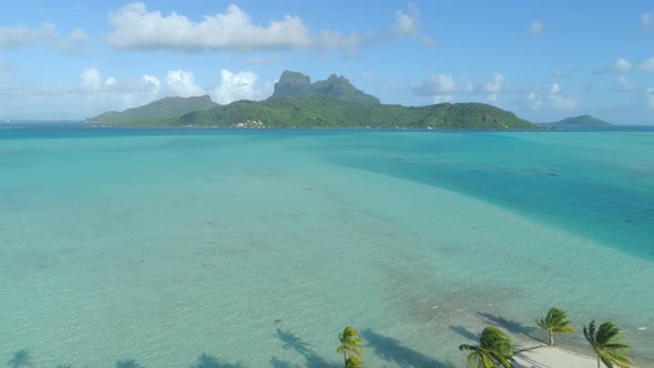 Aerial drone view of a deserted island near Bora Bora tropical island