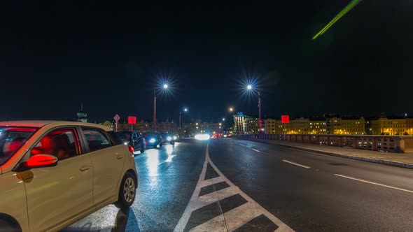 Traffic on the Jiraskuv Bridge Over the Still Waters of the River Vltava in the Centre of Prague