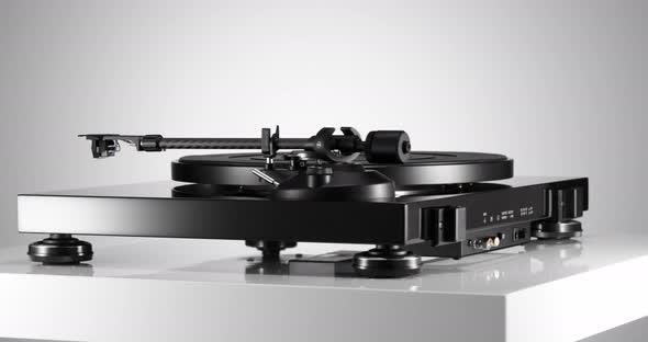Black Varnished Record Player Spinning on White Table