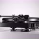 Black Varnished Record Player Spinning on White Table - VideoHive Item for Sale