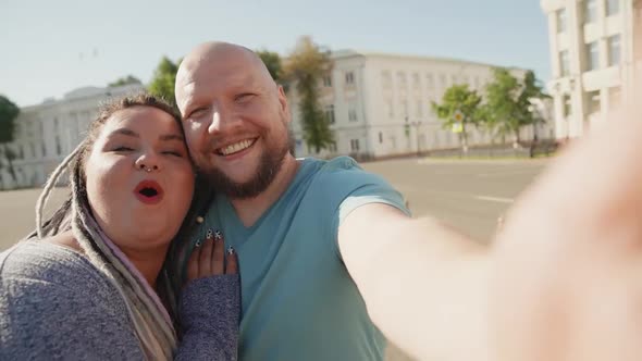 Happy Diverse Friends Taking Selfie at City Background. Two Smiling Stout Body Positive People