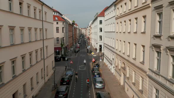 Forwards Tracking Shot of Cyclists Riding on Bike Highway in Linienstrasse Street Where Cyclists
