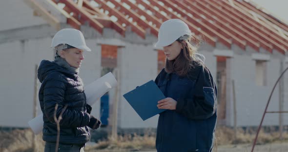 Female Contractor Arguing with Engineer at Incomplete Site