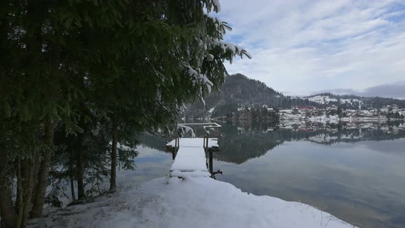 Snowy waterfront pier