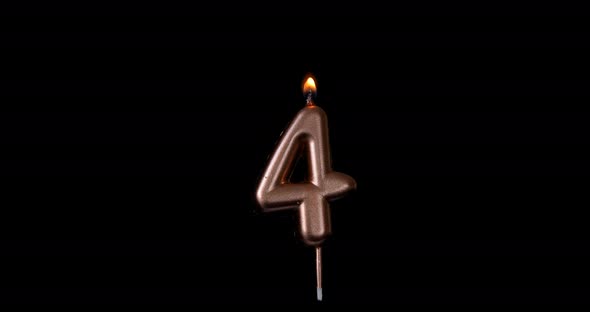 Realistic full-sized single birthday candlelight 4 four number isolated on black background. 