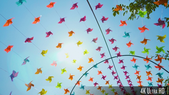 4K Colorful Pinwheels Spin on a Sunny Summer Day
