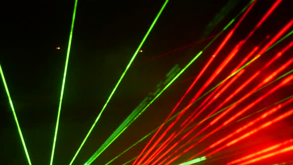Light Laser Show on a Black Background of the Night Sky Outdoor Performance