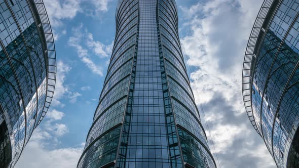 Timelapse Skyscrapers High Office Buildings Facades Blue Sky and Clouds Moving Fast in Timelapse