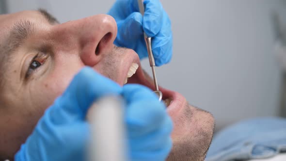  Male Patient Receiving Dental Treatment