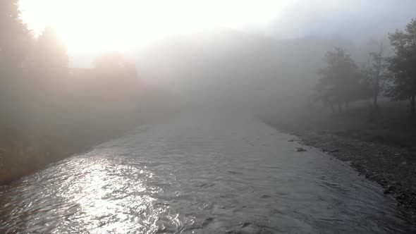 Fog Over River at Countryside