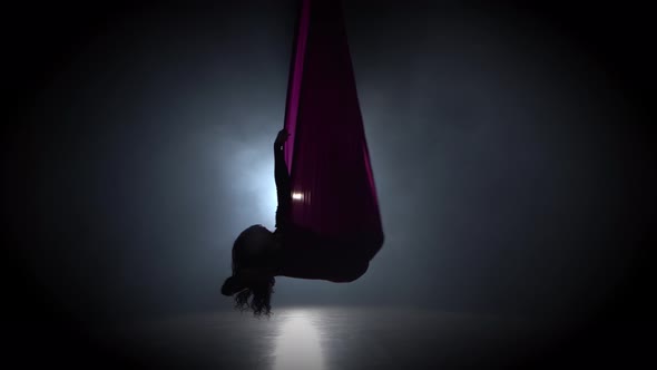 Woman Aerial Gymnast Performing on Violet Silk in Circus Stage. Exciting Acrobatic Show 063