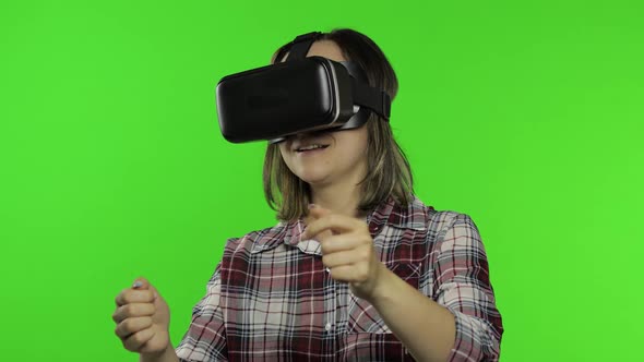 Woman Using VR Headset Helmet To Play Racing Game. Watching Virtual Reality 3d 360 Video. Chroma Key