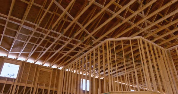 The Inside View of a New Wooden Building Shows a Wood Beam Framework Under Construction with a