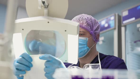 A Laboratory Worker Checks the Condition of the Samples Before Testing