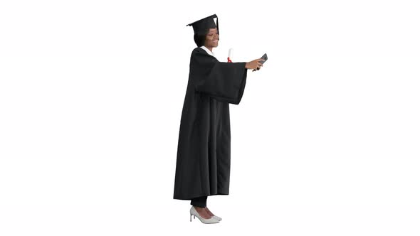 Happy African American Female Graduate Holding Diploma and Making Selfie on White Background
