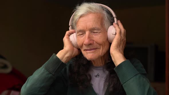 Elderly Country Woman Listens to Music for the First Time Through Wireless Headphones