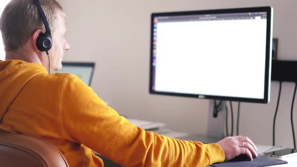 Stay at Home. a Man Works at Home at a Computer During the Coronavirus Pandemic.