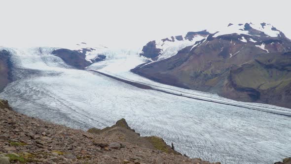 Women Rises on a Mountain Ridge