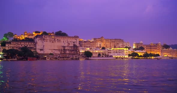 Udaipur City Palace on Bank of Lake Pichola with Tourist Boat - Rajput Architecture of Mewar Dynasty