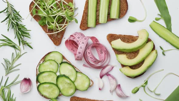 Bread with Cheese Vegetables and Herbs on a White Background