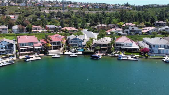 Aerial fly by of homes on community Lake Mission Viejo