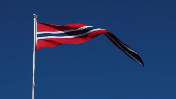 Norway Pennant Flag Waving in the Wind Against Deep Blue Sky.