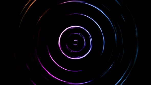 Blue and Purple Neon Circles Rotate on a Dark Background