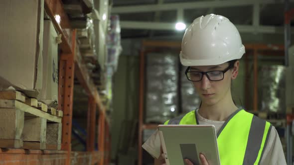 Female Supervisor in Safety Vest Helmet and During Factory Inspection