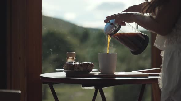 French press coffee brew poured in a cup, morning lovely homemade breakfast inside the house