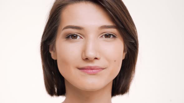 Portrait of Young Pretty Girl Playing Mimicry and Smiling