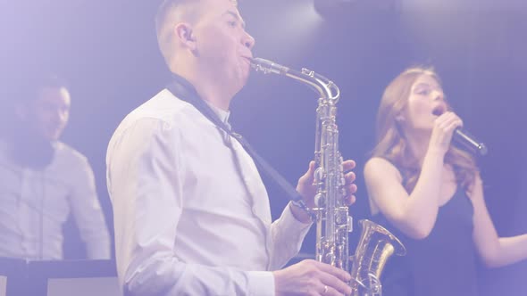 Vocalist Girl From Musical Group Band Dancing Singing Performing on Concert Musician Stage