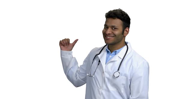 Smiling Doctor Pointing to Copy Space