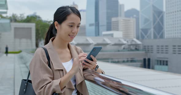 Woman use of mobile phone online