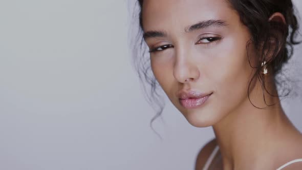 Close-up of Pretty Young Female Smiling To the Camera with No Make Up and Perfect Skin