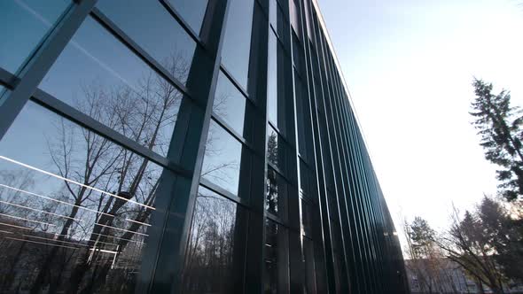 Motion Past Stylish Office Building with Dark Glass Facade