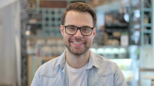 Young Man Smiling at the Camera