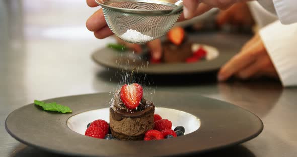 Chefs putting finishing touch on desserts