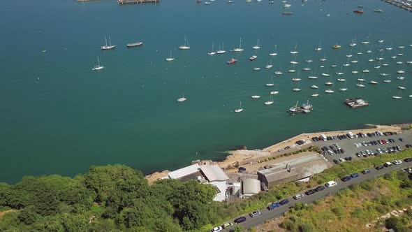 Aerial view of harbour in Brixham, England. Sky view of docked sail boats.