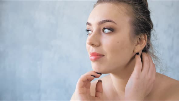 Closeup of Fashion Young Woman with Clean and Healthy Skin in Studio