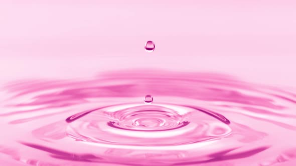 Super Slow Motion Shot of Splashing Pink Droplet at 1000Fps