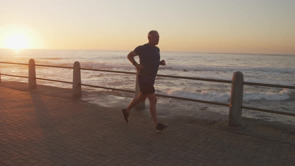 Senior man running on the promenade