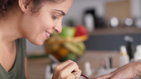 Close up video of women applying nail polish at home. Shot with RED helium camera in 8K.